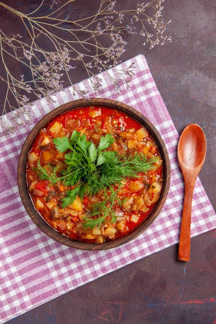 top-view-tasty-cooked-vegetables-sauce-meal-with-greens-dark-surface-sauce-meal-dish-food.jpg